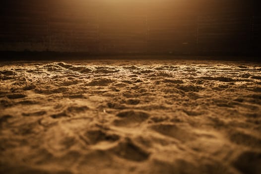 Sandy Rodeo Arena in the Warm Spotlight Closeup Photo.