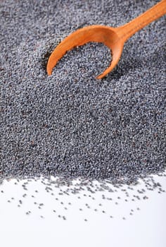 bulk poppy seeds and wooden spoon