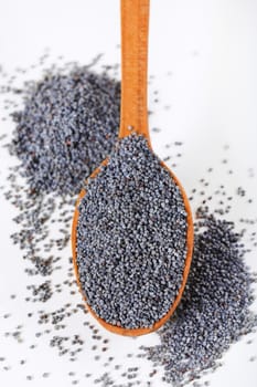 spoon of whole poppy seeds