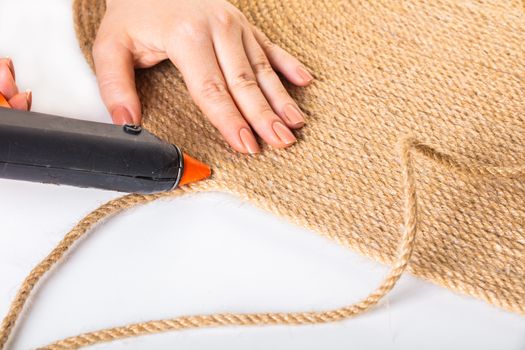 making handmade carpets from a rope close-up