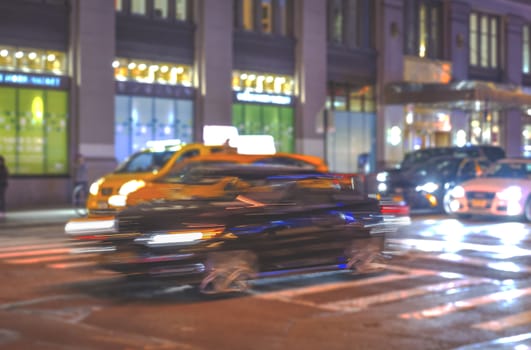 Car moving in traffic city street. Blurred shot