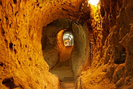 The Derinkuyu underground city is an ancient multi-level cave city in Cappadocia, Turkey.