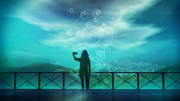 Silhouette of a girl doing selfie on a background of beautiful scenery and on the background of infographics about social networks.