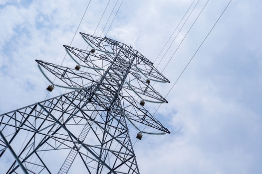 high voltage tower on sky background