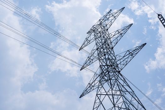 high voltage tower on sky background