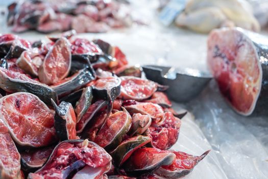 sliced striped catfish on shelf in fresh market