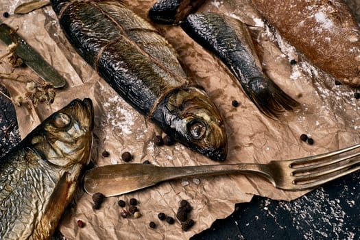 The sea fish prepared on a smoke, entirely and cut on slices.