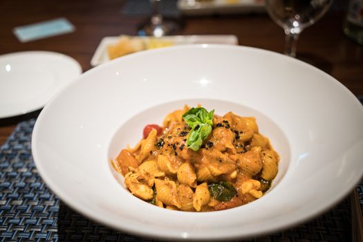 A bowl of delicious lobster pasta in a restaurant.