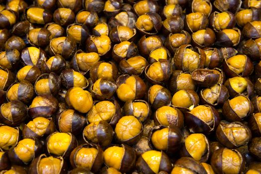 Bunch of roasted chestnuts at street stall