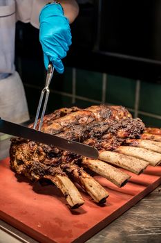 Chef Carving prime rib of  roast Wagyu beef 