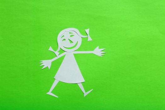 background of colored cardboard. the girl is made of white paper. in the style of a funny cartoon.