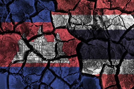 Cambodia and Thailand flag on cracked ground . Confliction and crisis concept .
