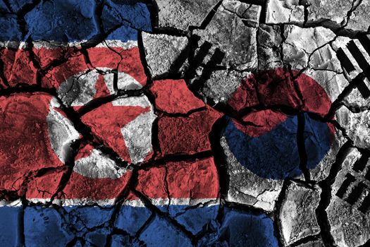 North and south korea flag on cracked ground . Confliction and crisis concept .