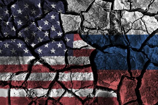 America and Russia flag on cracked ground . Confliction and crisis concept .