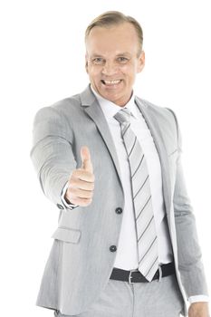 Mature business man showing thumb up gesture, isolated on white background