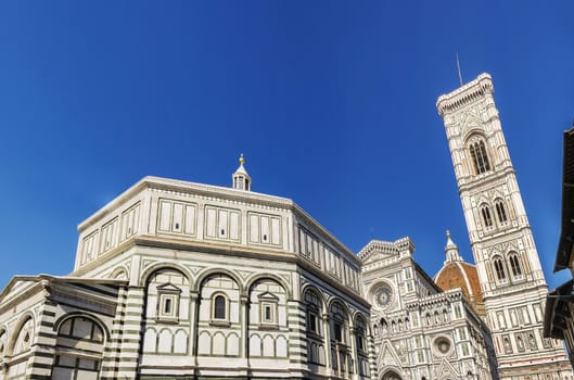 Famous Santa Maria del Fiore cathedral church with Baptistery in Florence. View from below