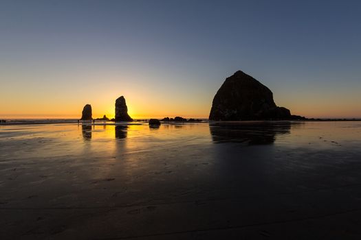 Haystcak Rock and the Needles at Cannon Beach Oregon Coast low tide during sunset