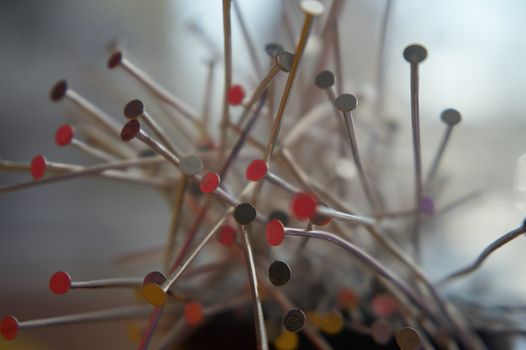 Bouquet of building nails, reflections of colors on the surface of silver nails. Close-up, selective focus.