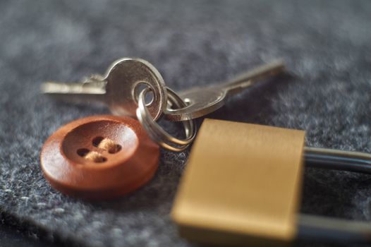 Brass lock, keys playing with light, shadow, reflection and surfaces, selective focus