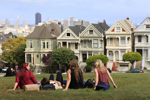 San Francisco, California, USA - September 12, 2013 : group of young girls enjoying free time in the Alamo Square park, San Francisco, California. USA