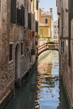 beautiful view of the canal with a floating boat in Venice, Italy
