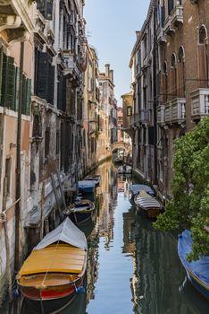 beautiful view of the canal with a floating boat in Venice, Italy