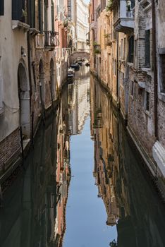 beautiful view of the canal with a floating boat in Venice, Italy