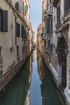 beautiful view of the canal with a floating boat in Venice, Italy