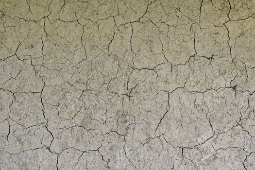 Drought, the ground cracks, no hot water, lack of moisture. Dried and cracked ground. Cracked surface, dry soil in arid areas.