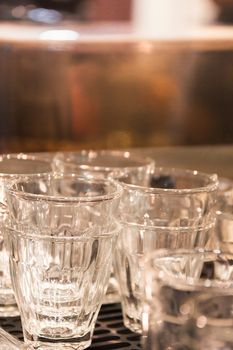 Selective Focus Raw Of Glass Vintage Close-Up, Different Glass Bottles In The Background, Vintage Piture Tone.