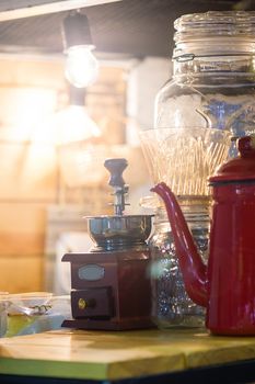 Coffee Grinder And Pot Of Coffee On The Coffee Beans Background With Vintage Light , Abstract concept.