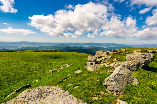 huge boulders on the edge of hillside. fine weather in summer mountain landscape