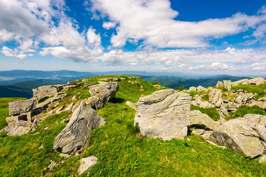 huge boulders on the edge of hillside. fine weather in summer mountain landscape