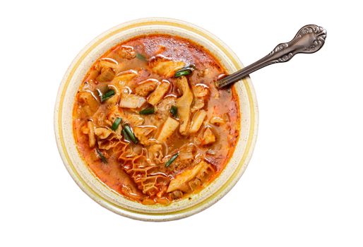 Traditional and very popular Slovakian soup from beef tripe cut out on white background