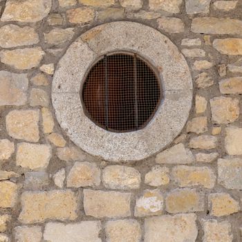 The circle window on stone wall, for background