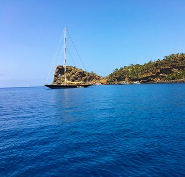 a sailship on the ocean is ready to start from the bay