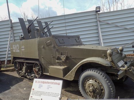 a german half track car in a museum workd war