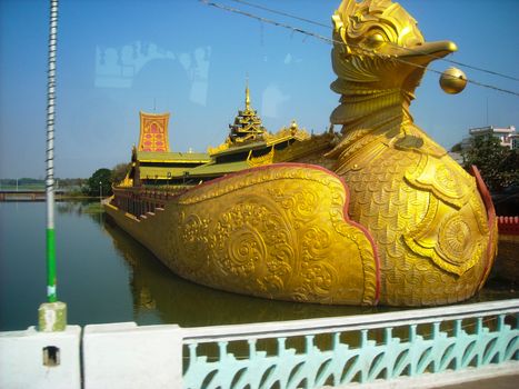 a golden boat in burma at sightseeing