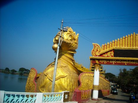 a golden boat in burma at sightseeing