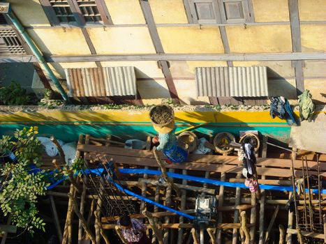 a house is building with bamboos in burma