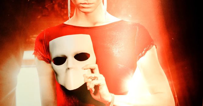 young woman holding mask.Faceless concept. Person without face.