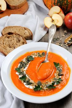 A wipe of pumpkin-apple soup with a tender, soft consistence,  yoghurt  and seasoned with pumpkin seeds and sunflower seeds. This is what you need for those who watch their health.