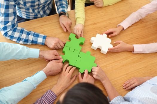 Hipster business successful teamwork concept, business people group assembling jigsaw puzzle