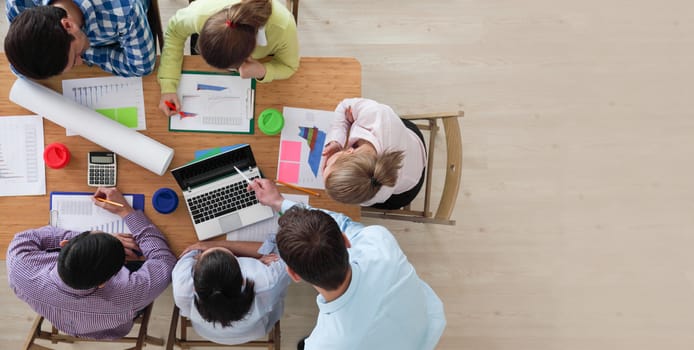 Business team meeting, people in casual clothes working with financial statistics at office desk