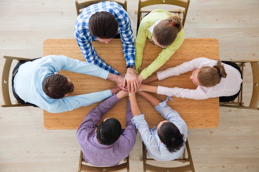 Business team stack hands, support concept, top view
