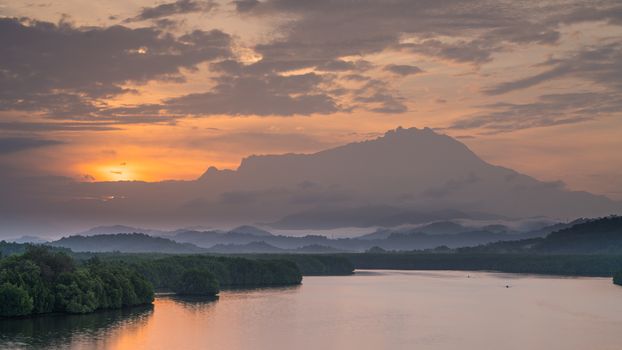 Vew of Mengkabong river and Mt Kinabalu from Mengkabong bridge.