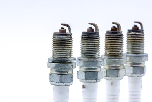 Old spark plug isolated on the white