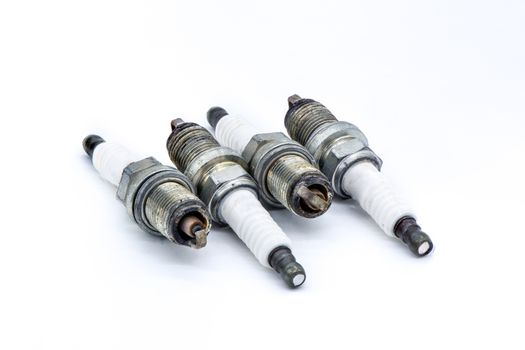 Old spark plug isolated on the white