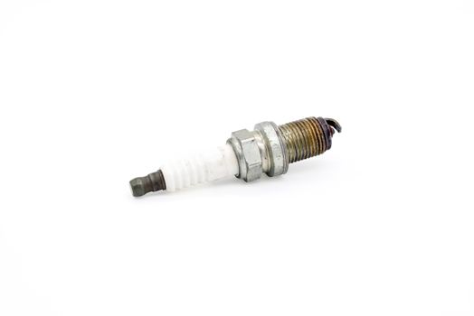 Old spark plug isolated on the white