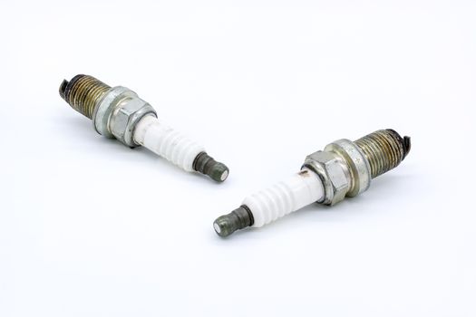 Old spark plug isolated on the white